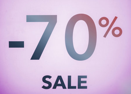 Seasonal discounts in stores, sale, Black Friday and shopping concept. discount 70 percent discount in the shop window.の写真素材