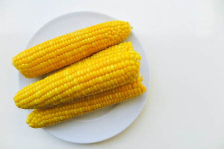 view of the raw home Golden corn cob on the table, selective focus.の写真素材