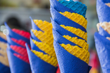 colorful waffle cones and blue paper napkins.