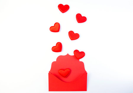 Valentine s day, red hearts from the red envelope isolated on white background.