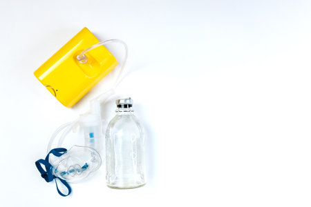 tube mask nebulizer and tubular transparent cable, saline on a white background, inhalation.の写真素材