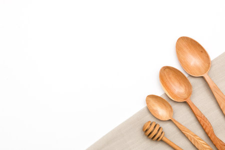 Houseware: wooden kitchen utensils, isolated on white background top view. Zero waste, eco friendly concept. Flat lay.の写真素材