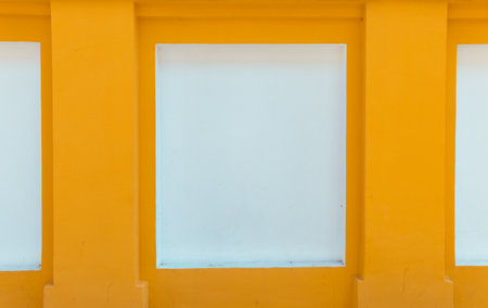 Street image of bright yellow and white wall. Selective focus.の写真素材