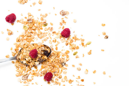 Crispy muesli with raspberry dry Breakfast isolated on white background selective focus, top view.の写真素材