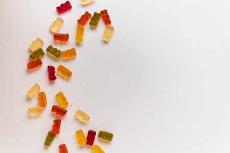 many jelly bears on a white tableの写真素材