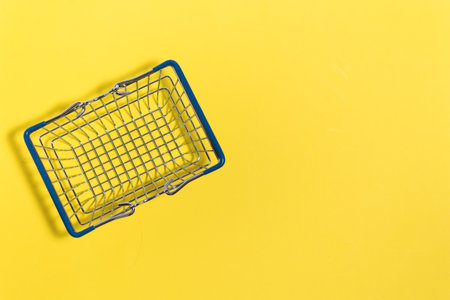 Food basket on a yellow background. Color 2021. Illuminatingの写真素材