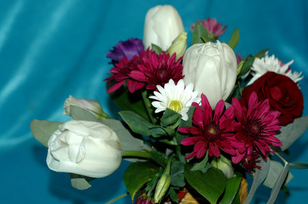 A beautiful bouquet of flowers from tulips, roses and chrysanthemums. Macro. You can use as a background.の写真素材