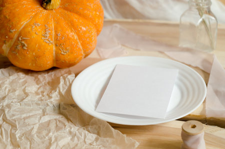 Autumn composition. Pumpkin halloween concept. Flat lay, copy space, mockup white paperの写真素材