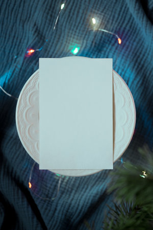 Christmas Ecological Mockup Card With Garland Lights. Christmas and New Year background with copy space for your text. Top view.の写真素材