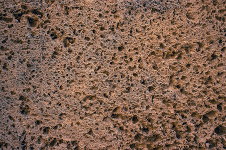 Close up old brown brick texture sandstone concept photo. Mediterranean architecture, urban city...