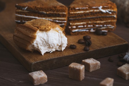 three tender cake with a spoon on a gray vintage wooden background. Selective focus, close up. background for postcardの写真素材