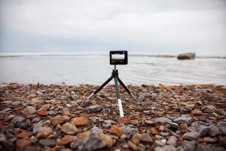 small modern action camera, action camera removes sea view.の写真素材