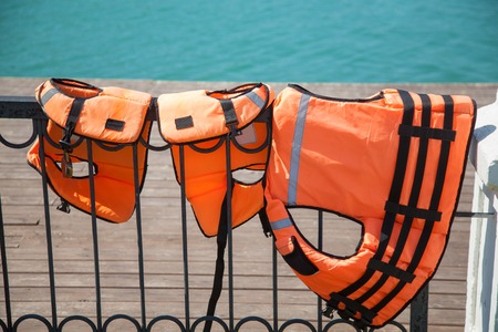 close-up of life jackets on the lakeの写真素材