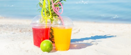 Bright Fresh healthy juices, fruit, pineapple on the background of the sea. Summer, rest, healthy lifestyle Copy space Bannerの写真素材