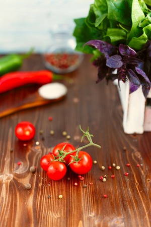 Cherry, tarragon, chili pepper, basil, spices Ingredients for cooking pasta. Food background on a wooden table Menu and restaurant conceptの写真素材