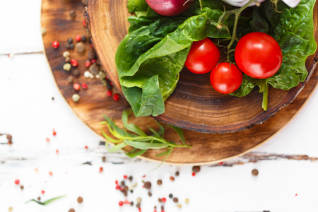 Cherry, tarragon, chili pepper, basil, spices Ingredients for cooking pasta. Food background on a white table Close upの写真素材