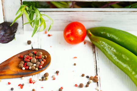 Spoon with spices, cherry, basil chili. Ingredients for cooking pasta. Close upの写真素材