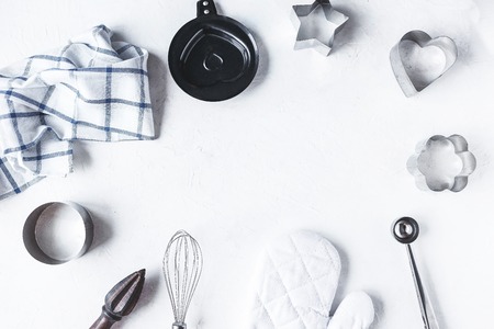 Frame composition dishes and kitchen accessories for baking on the Kitchen table on a white background Copy spaceの写真素材
