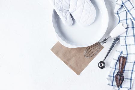 dishes and kitchen accessories for baking on the Kitchen table on a white background Copy spaceの写真素材