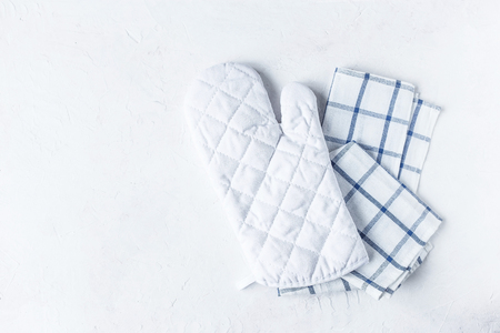 kitchen accessories , towel and potholder for baking on the Kitchen table on a white background Copy spaceの写真素材