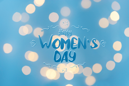 bright bokeh with lettering Happy Women's Day on a blue background Texture Copy spaceの写真素材