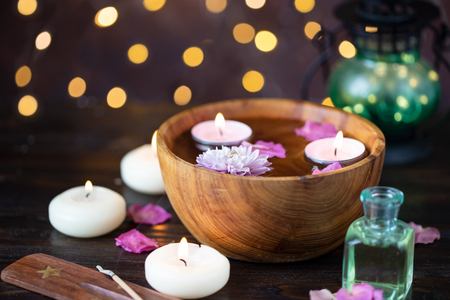 Aroma candles, aroma sticks, rose water, flower petals. Items for aromatherapy, massage. Relax and spa themeの写真素材