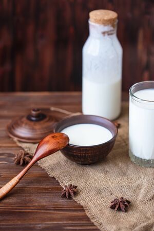 Homemade yogurt in a cup, a glass of kefir with probiotics Probiotic cold fermented dairy drink Trendy food and drink Copy space Rustic style.の写真素材