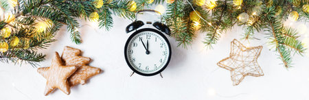 Christmas festive background. Fir branches, garlands, New Year's toys on a wooden background...