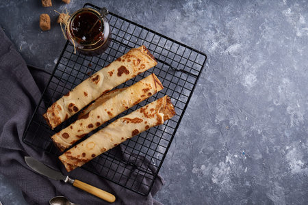 Traditional homemade pancakes with berry jam served on gray stone table Top view Copy spaceの写真素材