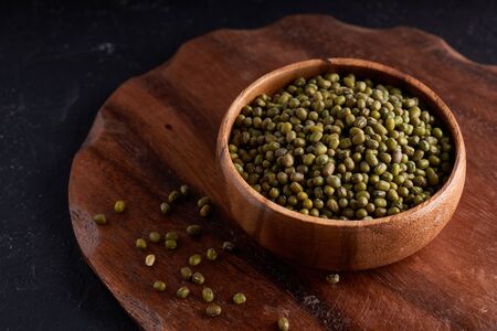 cereal mung beans mung in wooden bowl on black background Copy spaceの写真素材