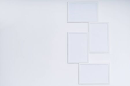 Stylish white mock up with vertical poster on white backgroundの写真素材