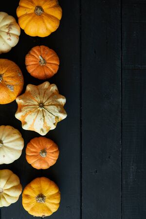 Autumn background of pumpkins on a wooden table. Halloween concept Vintage Top viewの写真素材