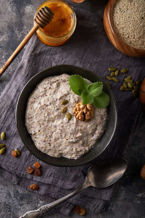 Healthy breakfast, seed and nut mix with honey and mint Food backgroundの写真素材