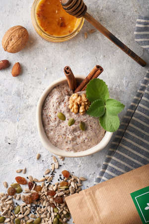 Healthy breakfast, seed and nut mix with honey and mint Food backgroundの写真素材