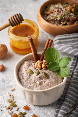 Healthy breakfast, seed and nut mix with honey and mint Food backgroundの写真素材