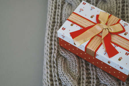 Christmas gifts, gray knitted blanket on gray background Copy spaceの写真素材