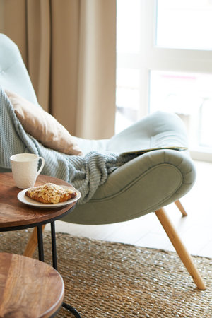 interior of a cozy room with a soft blue armchairの写真素材