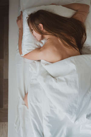 Young Beautiful girl in the kitchen prepares healthy food Close up of female handsの写真素材