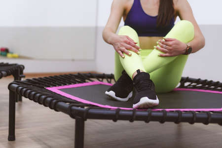 two sports girls are engaged in jumping on a sports trampoline.の写真素材