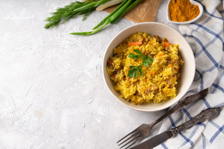 Traditional azian pilaf served in plate on gray background Close up Healthy traditional food