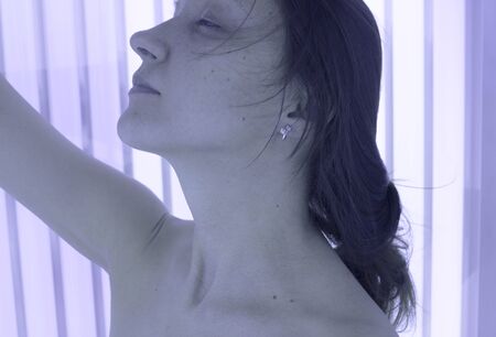 woman sunbathing in the Solariumの写真素材
