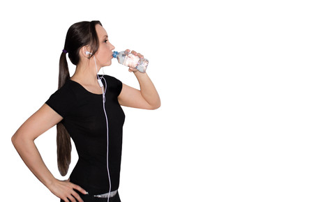 sporty girl drinking water from a bottle. sports lifeの写真素材