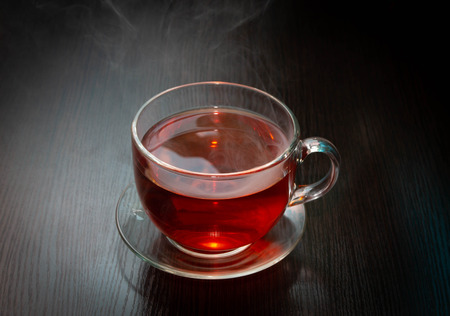 black wooden table hot black teaの写真素材