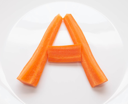 letter A from strips of natural fresh carrots, vitamin Aの写真素材
