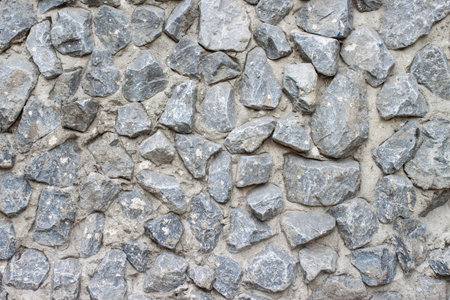 Untreated gray stone wall background
