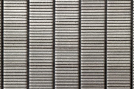 Gray metal steel staples background