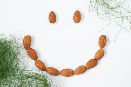 Almonds with smile shape form isolated white background