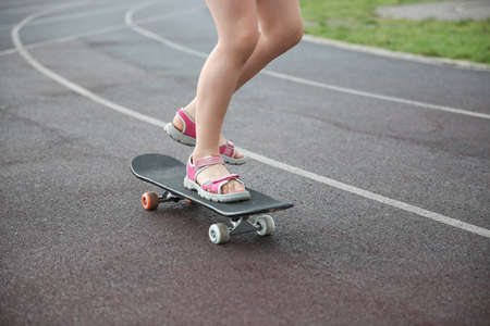 Stylish little girl child with skateboardのeditorial素材