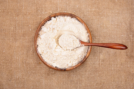 White onion heads with Punch on linen or jute sacking or fabric