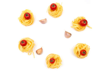 Raw Pasta with ingredients on white background. Top viewの写真素材